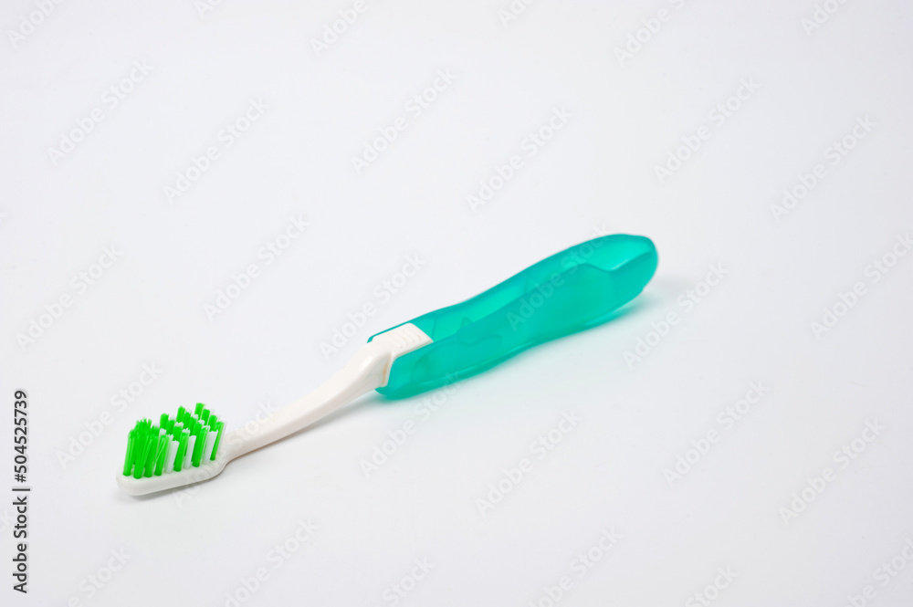 Folding plastic toothbrush for travel and tourism, shot on a white background. Folding plastic toothbrush for travel and tourism, shot on a white background.