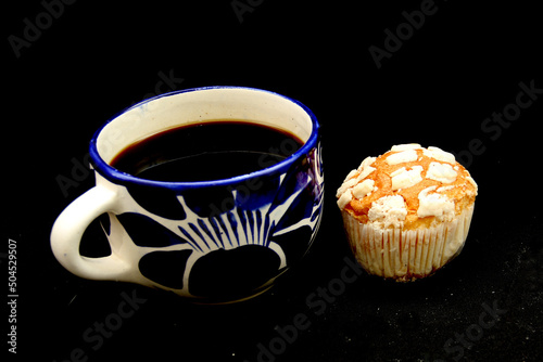 Fresh, delicious and fluffy Mexican bread Manteconchas cupake type vanilla and chocolate flavor accompanied by coffee on a white background traditional of the culture of Mexico	 photo