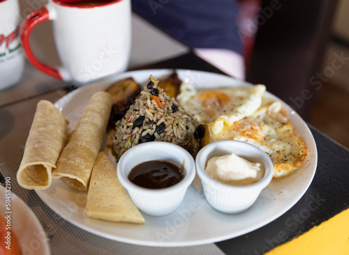 Typical Costa Rica Breakfast food gallo pinto and eggs and tortilla   photo
