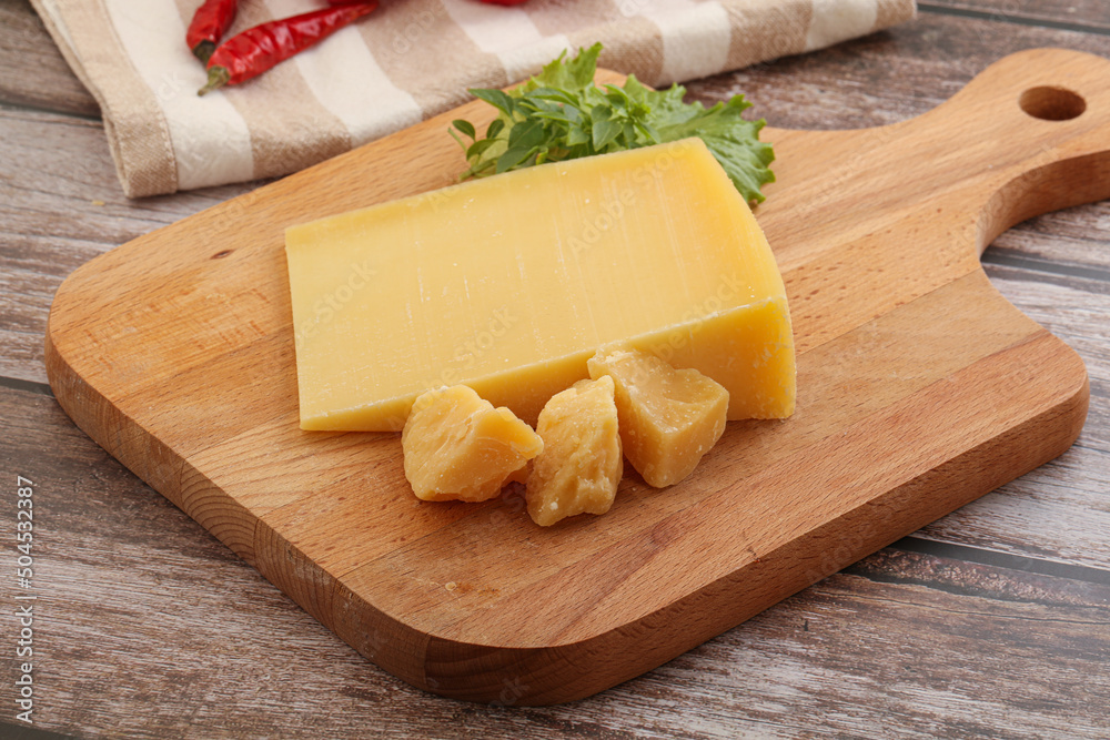 Parmesan hard cheese with small pieces Parmesan hard cheese with small pieces