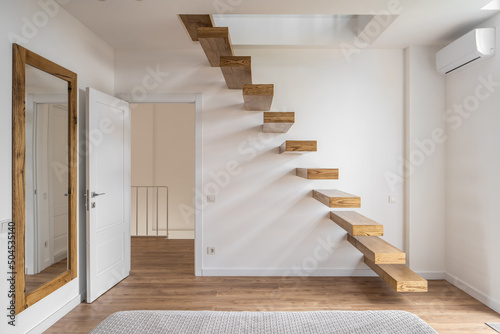 Three-level flat in modern style with stylish staircase