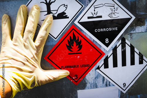 Warning symbol for chemical hazard on chemical container photo