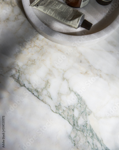 Flat lay background of marble bathroom bench top photo