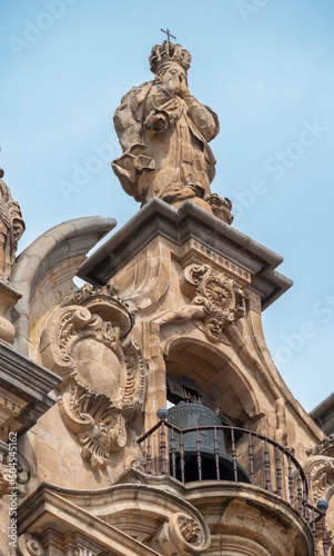 Campana en la espadaña de la iglesia La Clerecía de estilo renacimiento y barroco siglo XVII, actual universidad pontificia de Salamanca, España photo