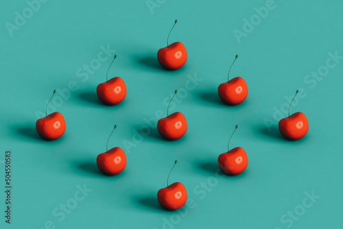 rhombus from cherries. 3d render on blue. photo