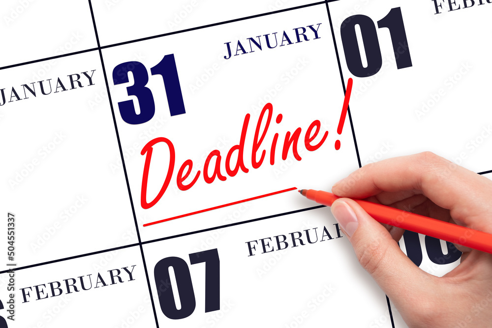 Hand drawing red line and writing the text Deadline on calendar date January 31. Deadline word written on calendar Hand drawing red line and writing the text Deadline on calendar date January 31. Deadline word written on calendar