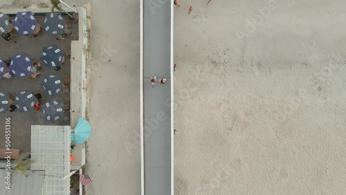 Aerial top down view of people walking in Fort Myeres beach Pier, Florida photo