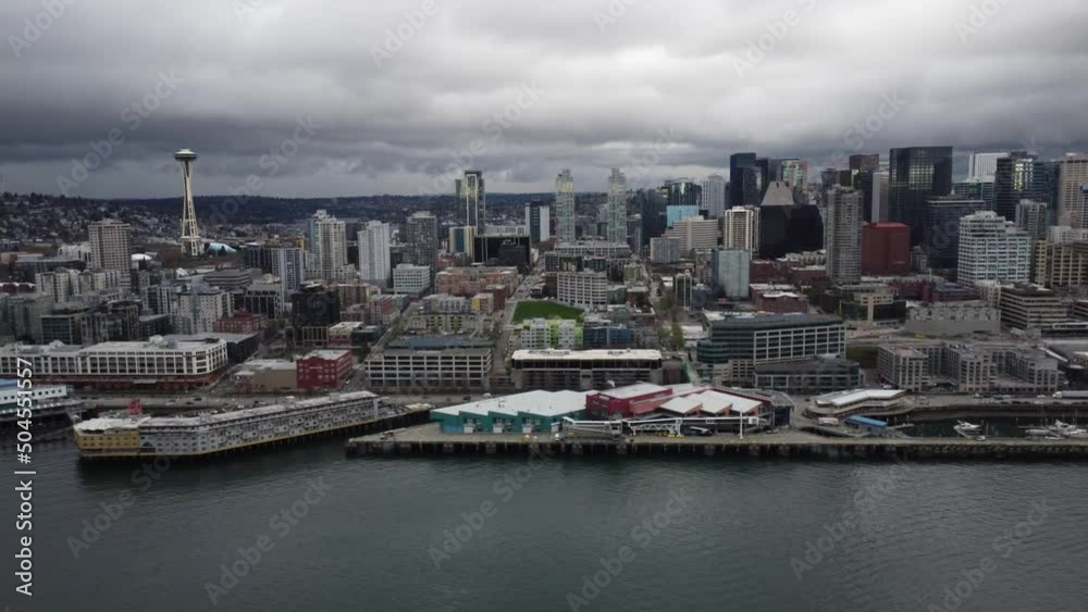 Aerial View of Seattle Skyline, Space Needle and waterfront on a Cloudy Day Aerial View of Seattle Skyline, Space Needle and waterfront on a Cloudy Day