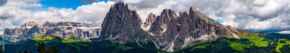 Panoramic view of Langkofel group or Sassolungo group in Italian Dolomite from the Alpine Green Plateau Seiser Alm in South Tyrol, Italy.