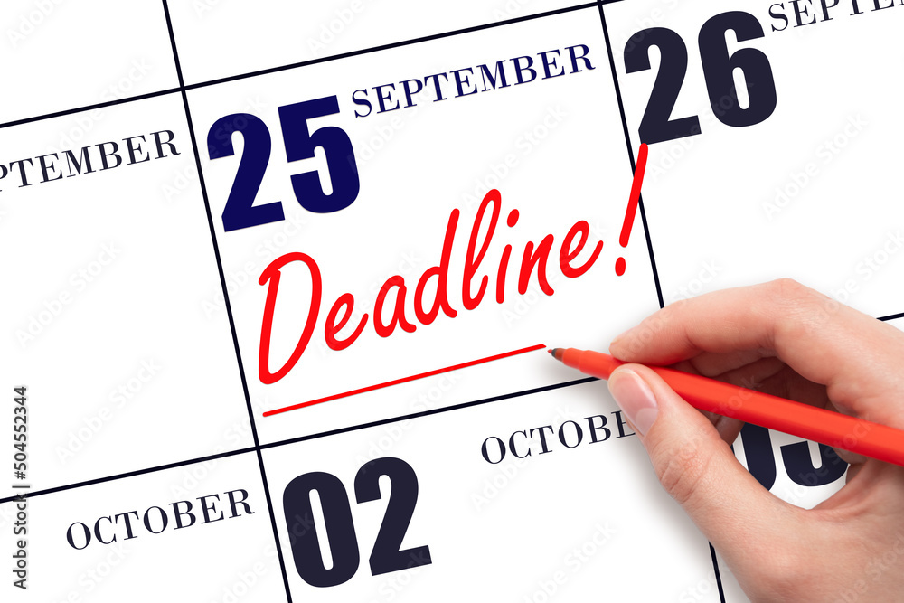 Hand drawing red line and writing the text Deadline on calendar date September  25. Deadline word written on calendar