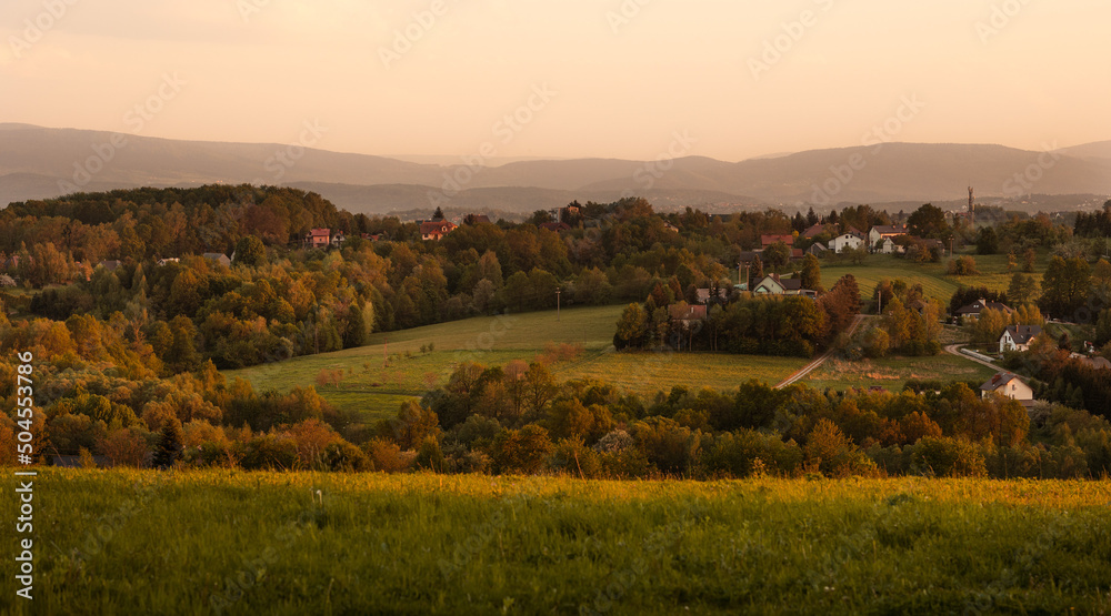 Sunset in the village, beautiful sun over the rural fields in Poland