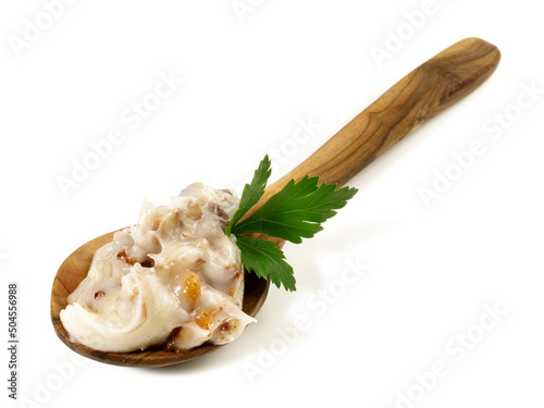 Traditional Pork Lard - Rendered Pig Fat with Greaves on a Spoon isolated on white Background photo