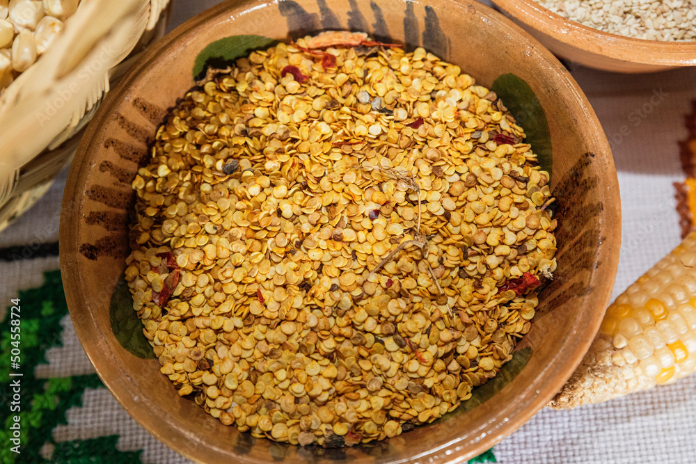 Top view of piquin chili seeds in a clay bowl Top view of piquin chili seeds in a clay bowl