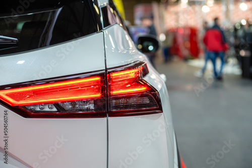 closeup of a red led taillight on a modern car, detail on the rear light of a car © ako-photography