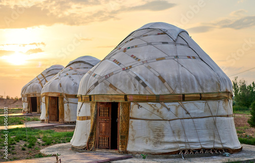 old asian yurts at sunset