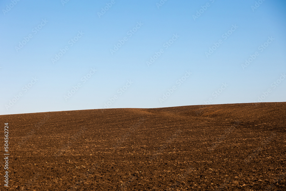 Bare field under the blue sky Bare field under the blue sky