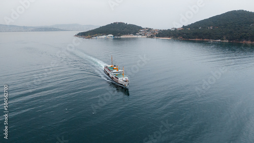 drone photo of a ferry passing by Prince Islands in Turkey photo