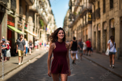 Happy woman walking on the street photo