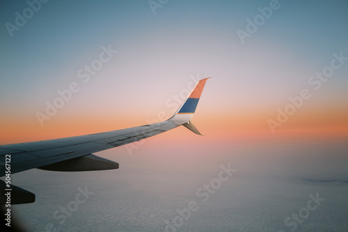 sunset through the plane window photo
