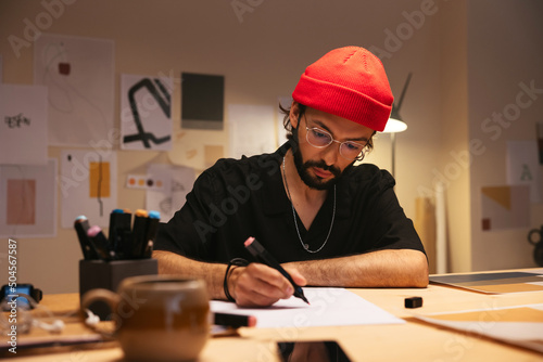 Male designer drawing marker pen photo