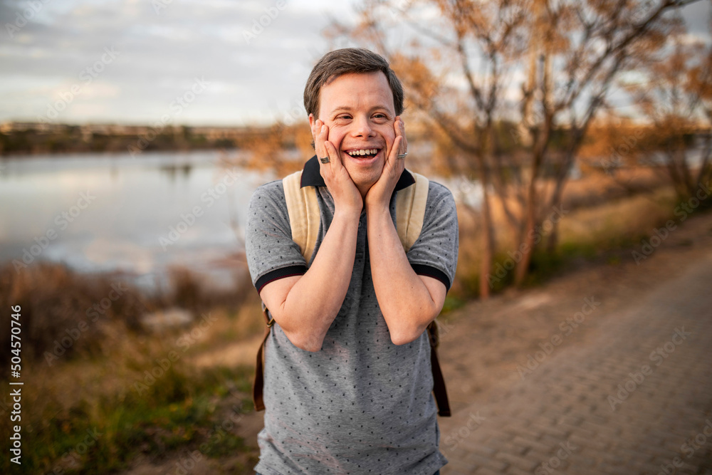 Man with down syndrome laughing happy
Man with down syndrome laughing happy