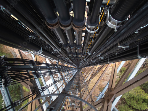 Overhead view of the telecommunication tower full of high-speed cables