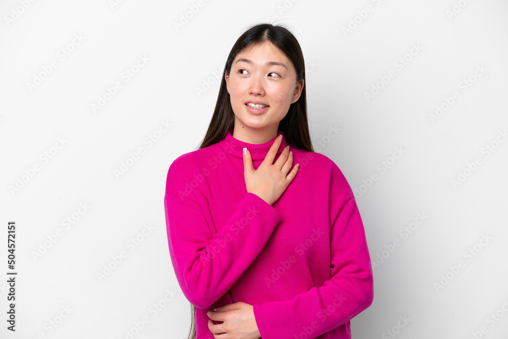 Young Chinese woman isolated on white background looking up while smiling Young Chinese woman isolated on white background looking up while smiling