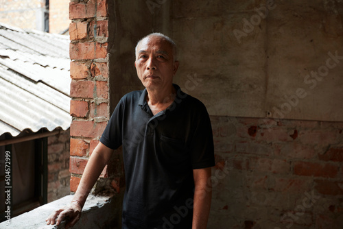 Asian middle aged man at home

