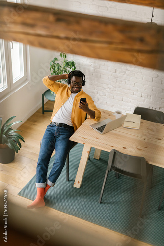 Afro-American Enjoying His Time Listening to Music