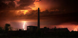 Thunder, lightning and storm over abandoned factory at summer night