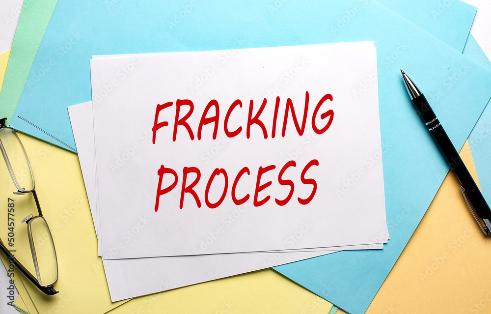FRACKING PROCESS text on paper on the colorful paper background FRACKING PROCESS text on paper on the colorful paper background