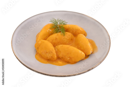 dumplings with tomato sauce in a plate on a white background