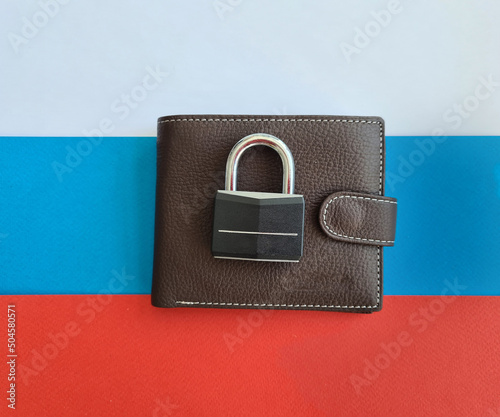 Wallet with lock on Russian flag. Poverty poverty and sanctions in Russia photo