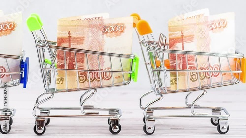 Shopping basket with Russian ruble notes, 5000 rubles in a cart