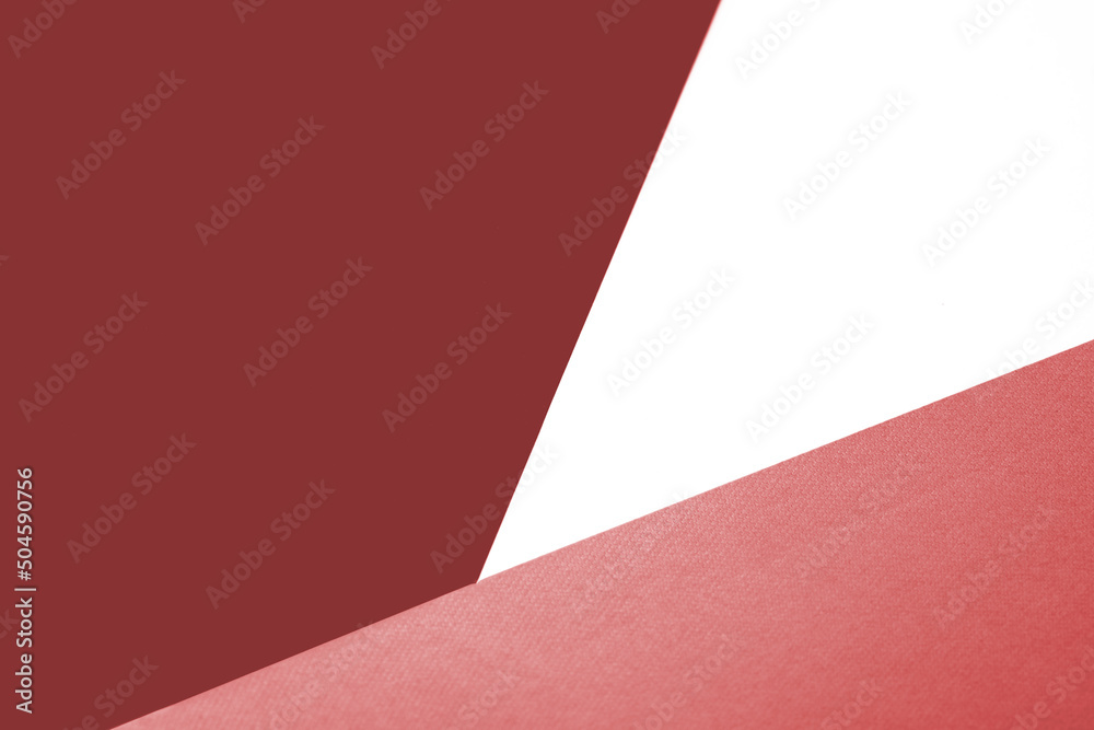 Peach, Red and white papers forming triangle shape textured background