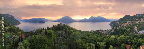 Panoramic aerial view of Vezio Castle during sunset. Drone shot in Como lake. Varenna  Italy