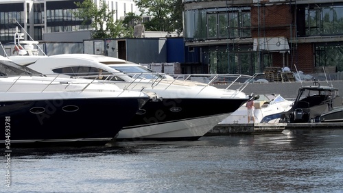 Yachts and boats at the pier. Panorama of the city on the beach. © markwar