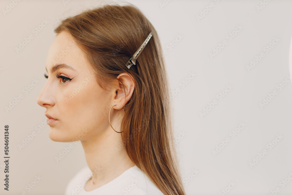 Beautiful young woman applying makeup beauty profile portrait Beautiful young woman applying makeup beauty profile portrait