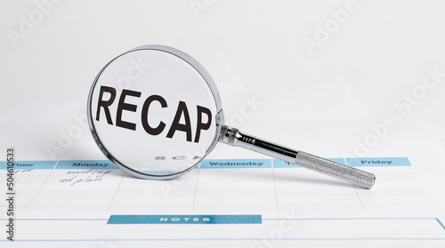Business recap, summary concept. Word through magnifying lens. High quality photo photo