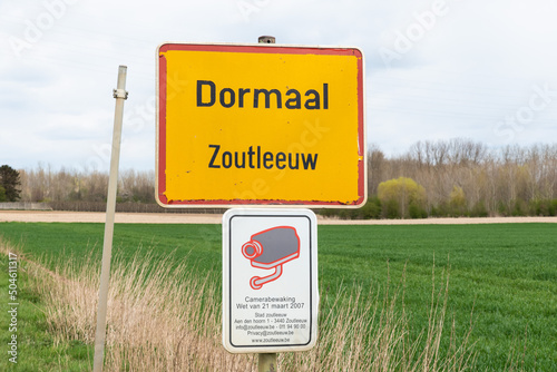 Dormaal, Flemish Brabant, Belgium  Sign of the Village Dormaal with a CCTV security warning sign photo