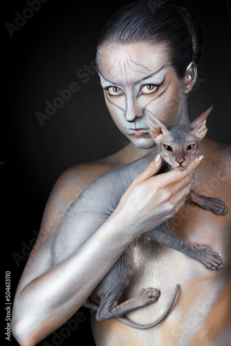 european model in cat make-up and bodyart photo