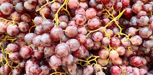 Ripe sweet fresh red grapes background, closeup photo