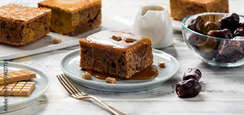 Easy Sticky Toffee Pudding is a deliciously gooey sponge cake drenched in warm toffee sauce that’s a favorite among the English.  photo