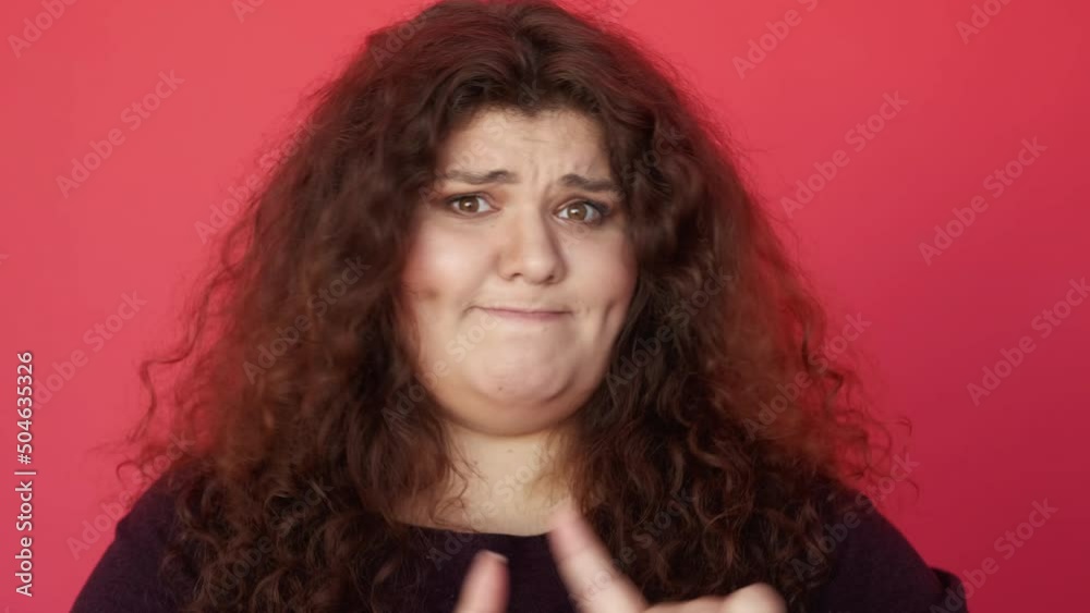 No gesture. Bad idea. Wrong choice. Refusal disagreement. Dissatisfied skeptic disgusted chubby woman rejecting offer with finger wag isolated on red. No gesture. Bad idea. Wrong choice. Refusal disagreement. Dissatisfied skeptic disgusted chubby woman rejecting offer with finger wag isolated on red.