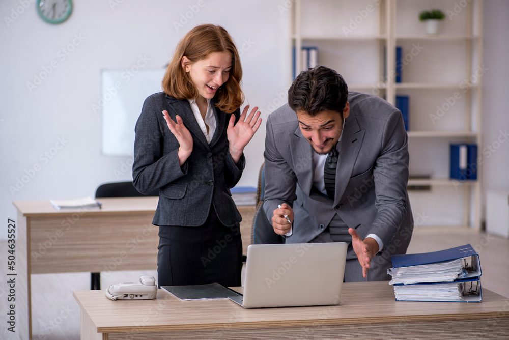 Two colleagues working in the office Two colleagues working in the office
