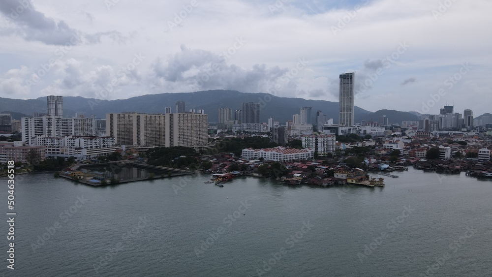 Georgetown, Penang Malaysia - May 13, 2022: The Clan Jetties of Georgetown Penang, Malaysia. Wooden villages built on stilts at the sea coast by the different clans of the Penang Chinese community.