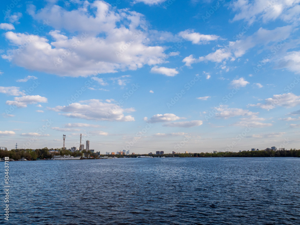 View of the city with clouds from the river