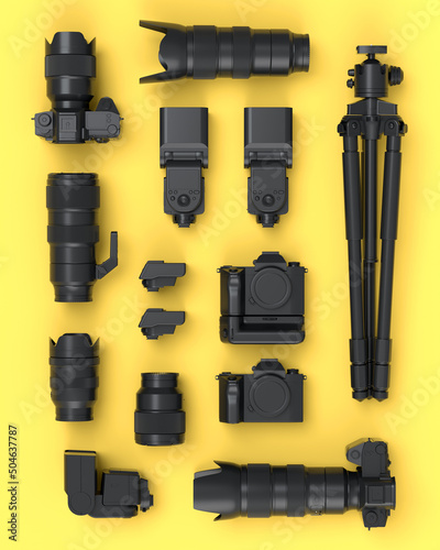 Top view of monochrome designer workspace and photography gear on yellow photo