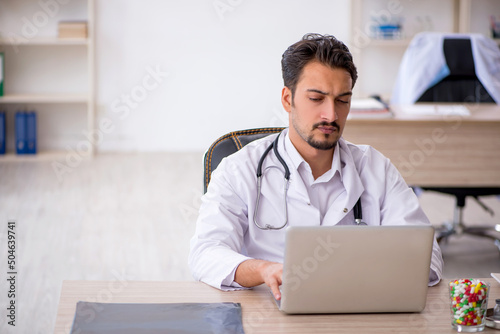 Young male doctor working in the clinic