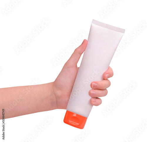 A hand holding sunscreen cream isolated on white background © Albert Ziganshin